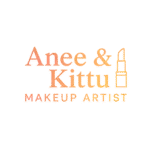"Makeover By Anee & Kittu Makeup Artist" logo with soft multicolor lighting in warm pink, orange, and yellow tones. The text appears in a clean serif font, with a minimalist lipstick icon beside it, representing a professional makeup brand based in Udaipur.